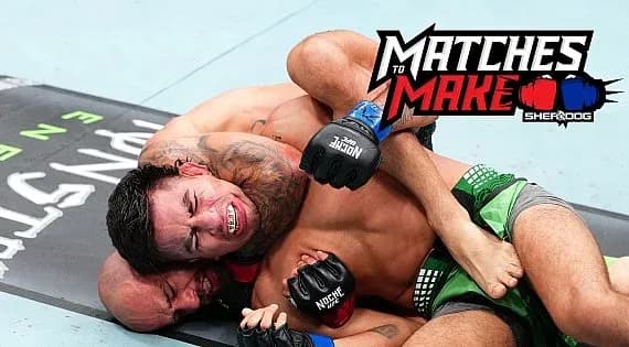 Two fighters grappling on the mat during match