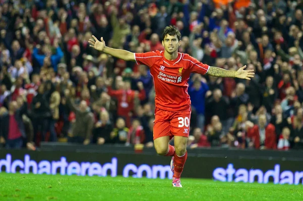 Player celebrating a goal in Liverpool jersey