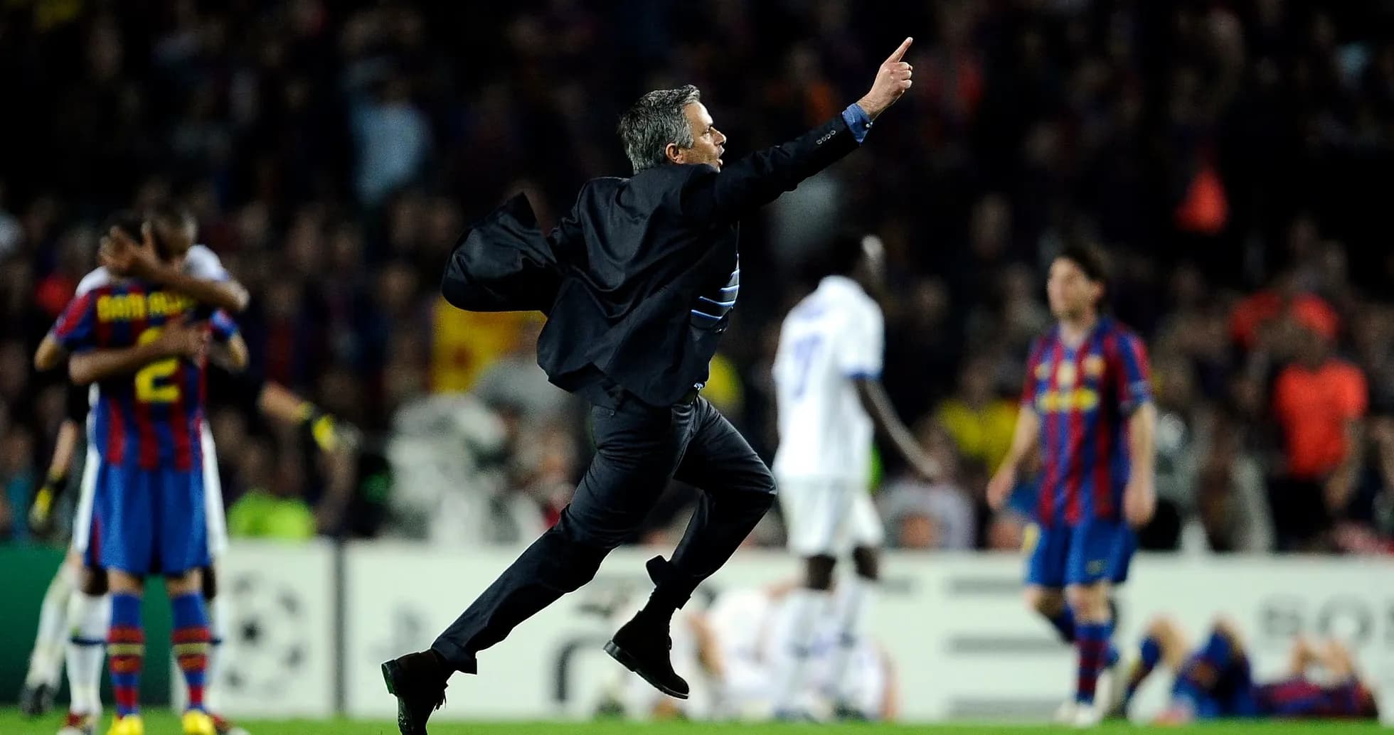Manager celebrating victory on the pitch