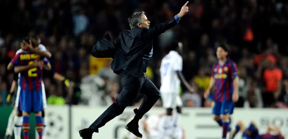 Manager celebrating victory on the pitch
