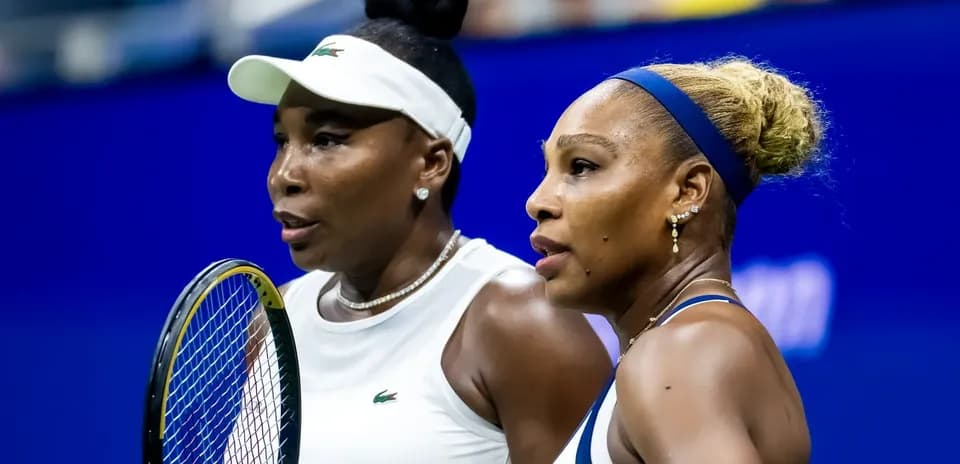 Venus and Serena Williams discussing during match