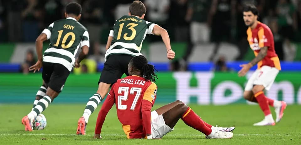 Rafael Leão sitting on the pitch during match