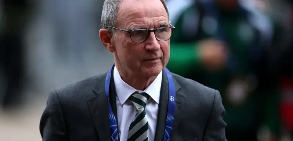 Man in suit with glasses walking at event