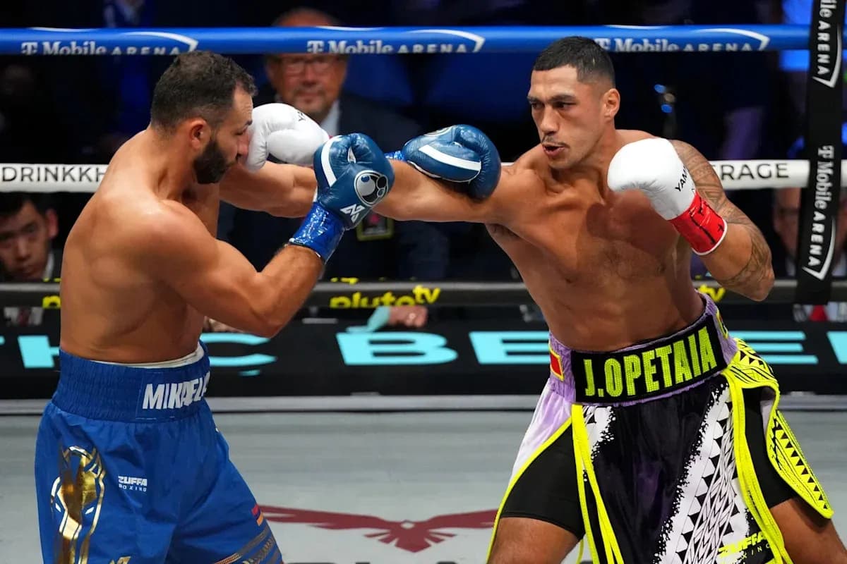 Two boxers exchanging punches in the ring
