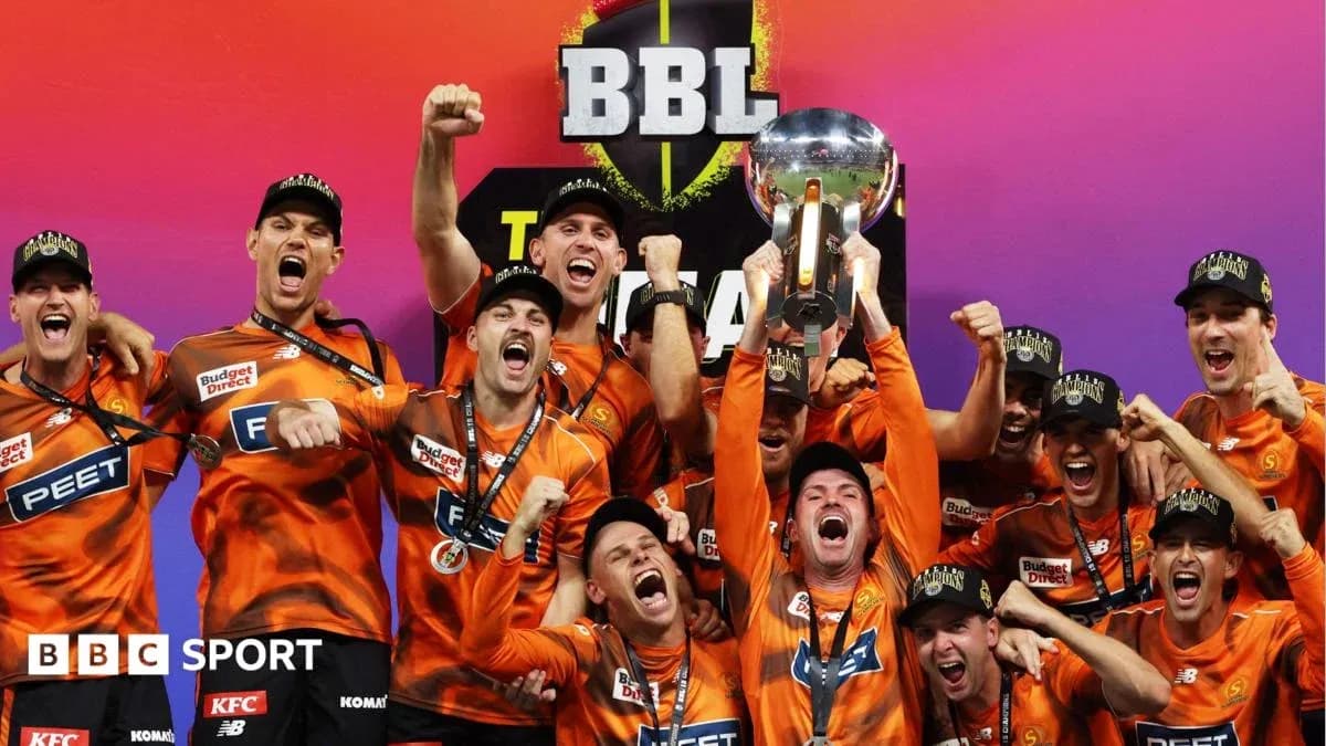 Team celebrating with trophy after championship victory