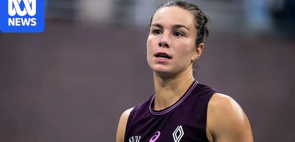 Athlete in purple uniform during competition