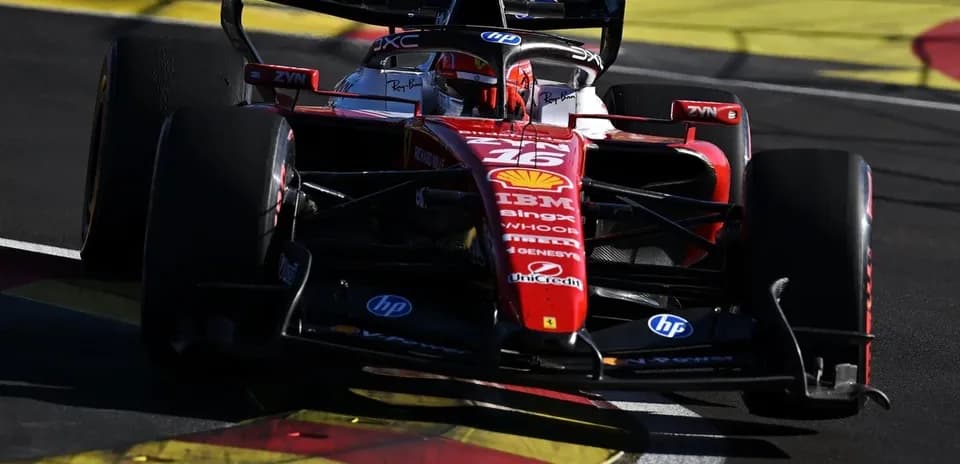 Ferrari Formula 1 car navigating a racetrack corner