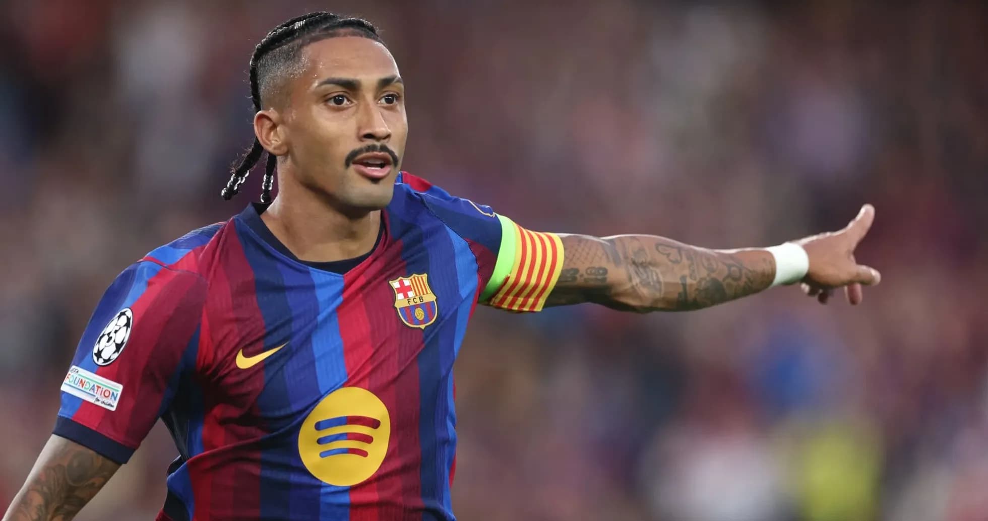 Barcelona player directing teammates during match
