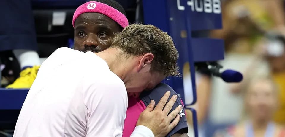 Players embracing during a tense moment in match