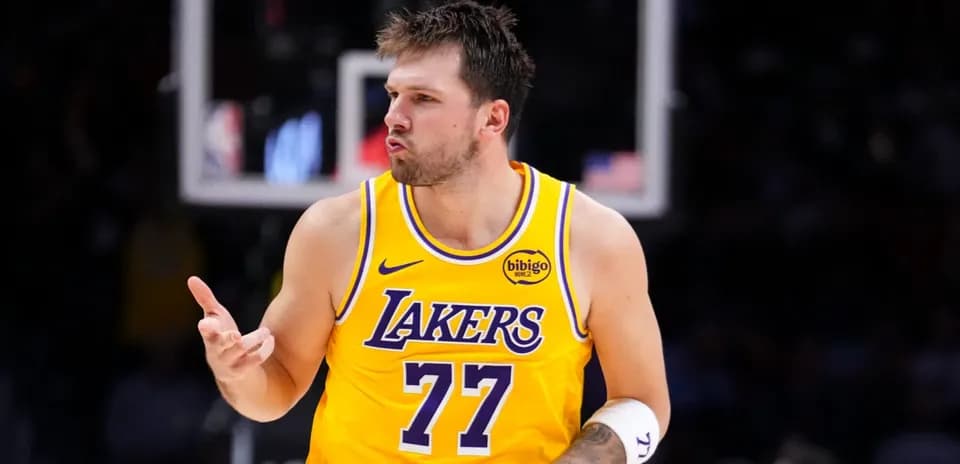Player celebrating during a game in Lakers jersey
