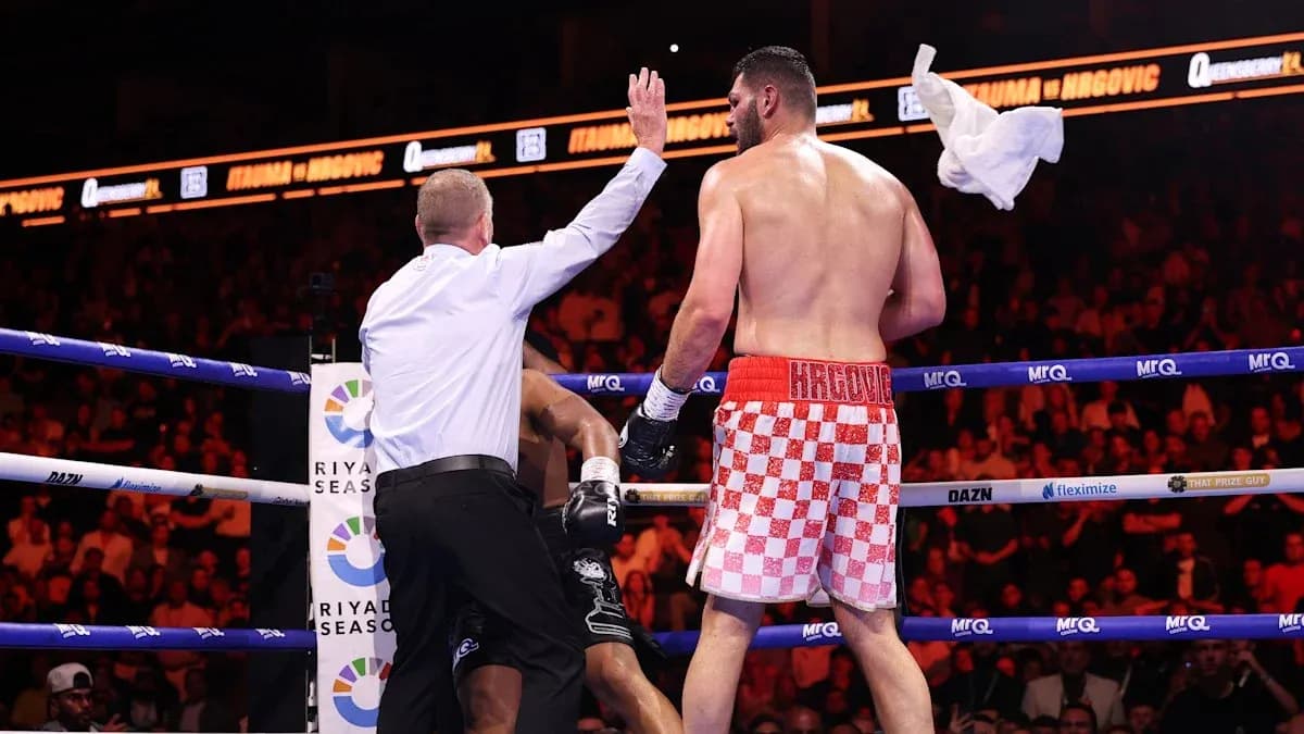 Referee stopping the boxing match with towel thrown