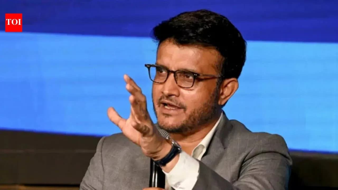 Speaker gesturing during a discussion on stage