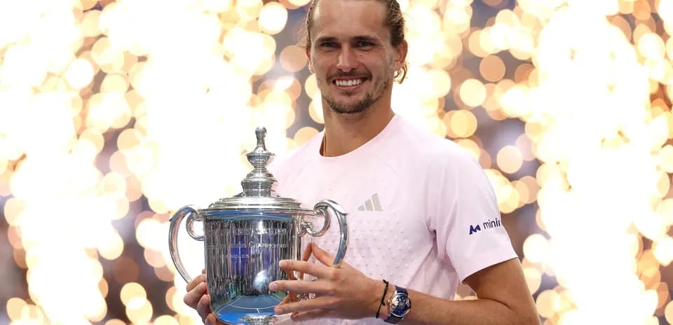 Player holding championship trophy with fireworks backdrop
