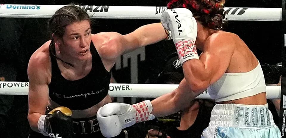 Boxers exchanging punches in a boxing match