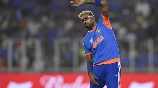 Cricketer gesturing during a match warm-up