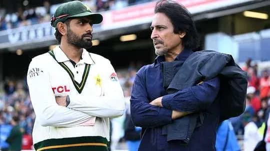 Two men conversing near cricket field