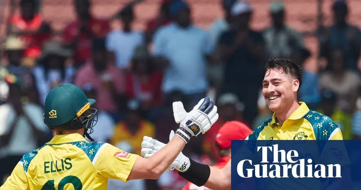 Two Australian cricketers celebrating a wicket on field