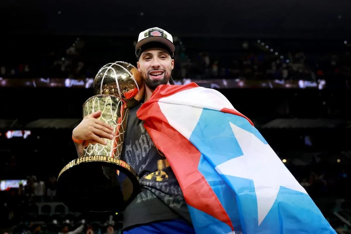 Player celebrating with trophy and flag after championship