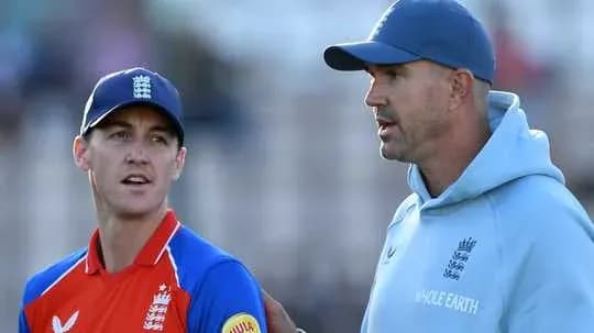 Coach discussing strategy with player during match