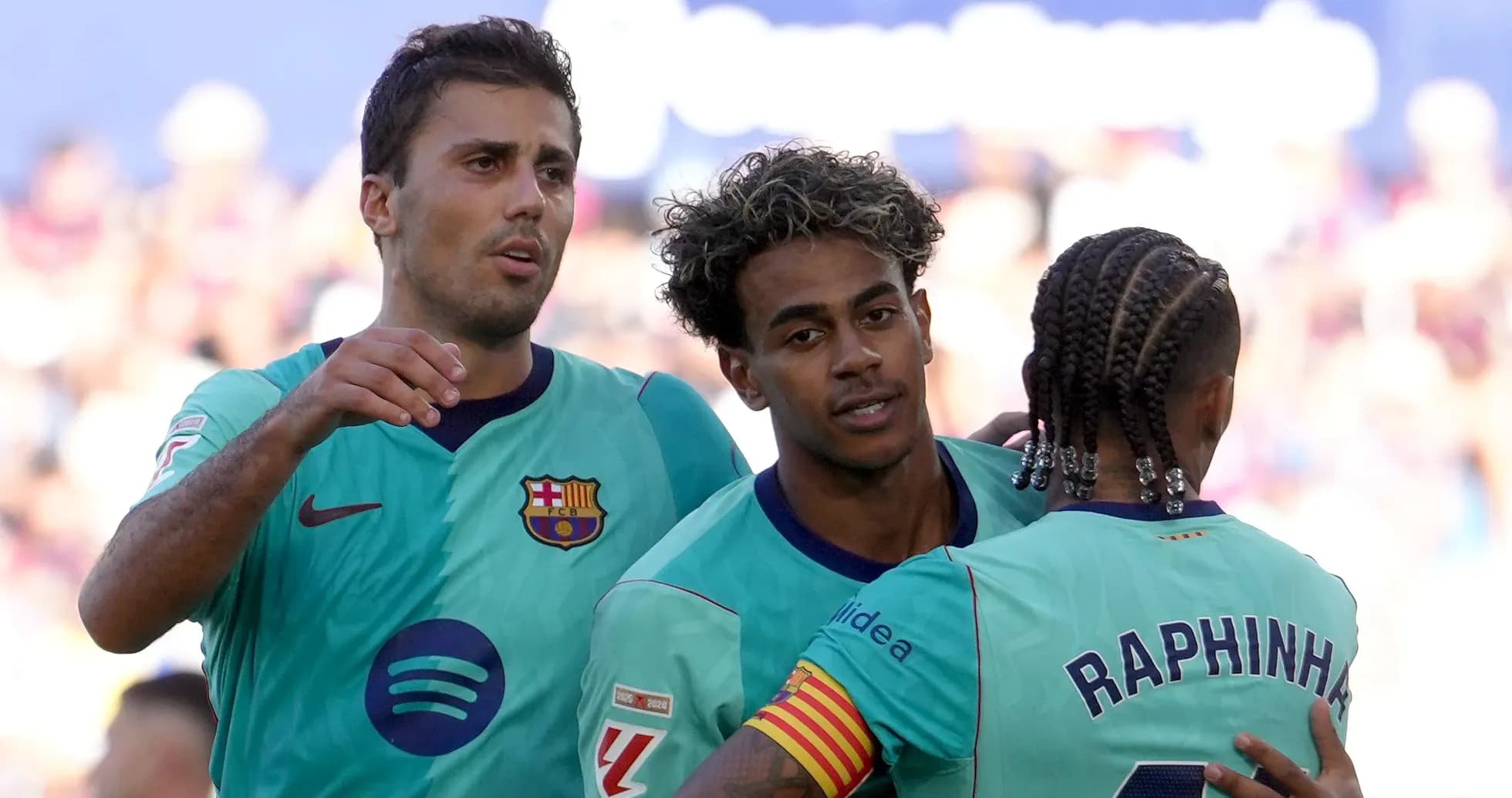 Barcelona players celebrating a goal on the pitch