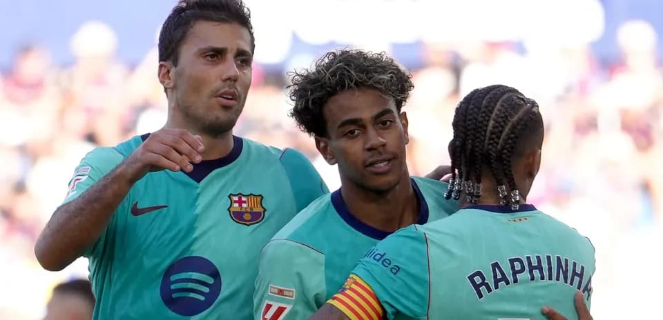 Barcelona players celebrating a goal on the pitch