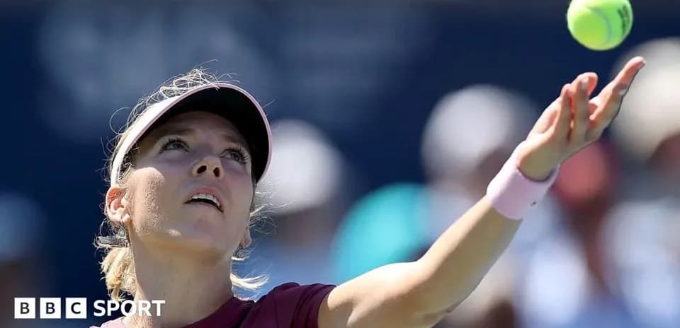 Tennis player serving the ball during match