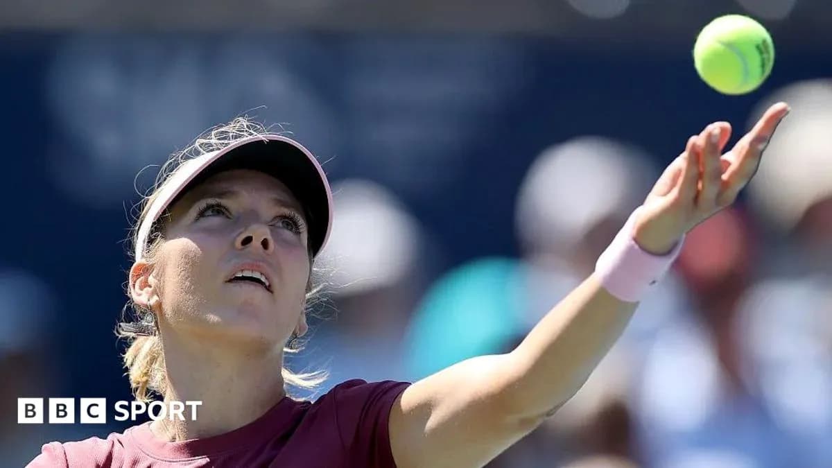 Tennis player serving the ball during match