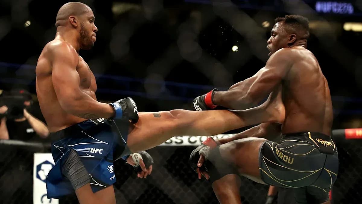 Two fighters exchanging kicks inside the octagon