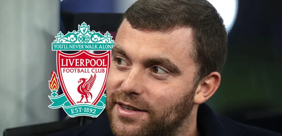 Person speaking with Liverpool FC logo in background