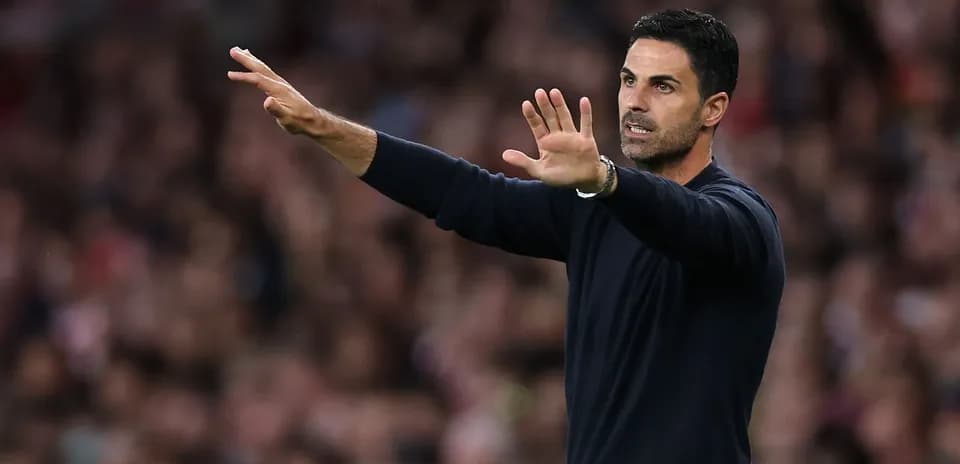 Manager gesturing from the sidelines during match