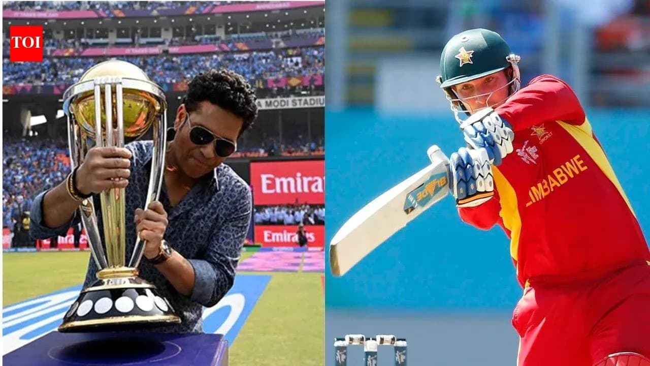 Sachin Tendulkar holding a trophy and a batsman