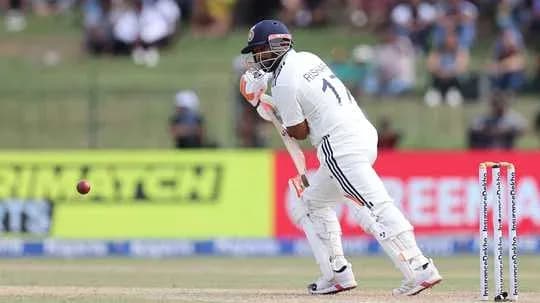 Batter playing a shot during a cricket match
