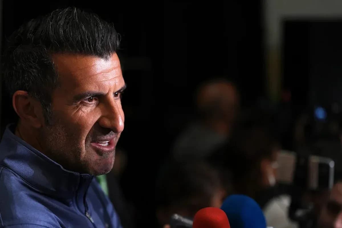 Person speaking at a press conference with microphones