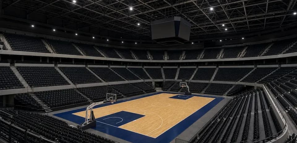 Empty basketball arena with court and seating
