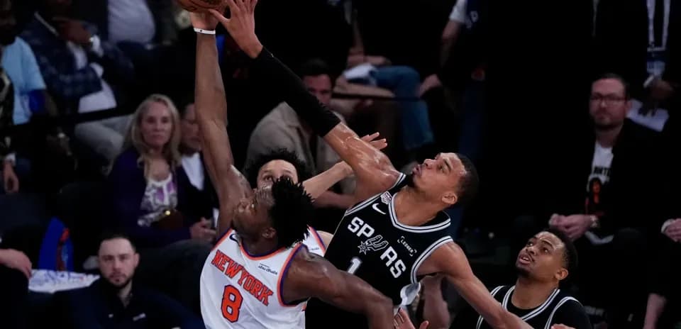 Player attempting a shot amid defensive pressure