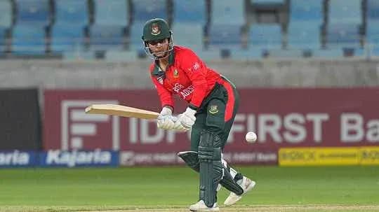 Batsman playing a shot during a cricket match
