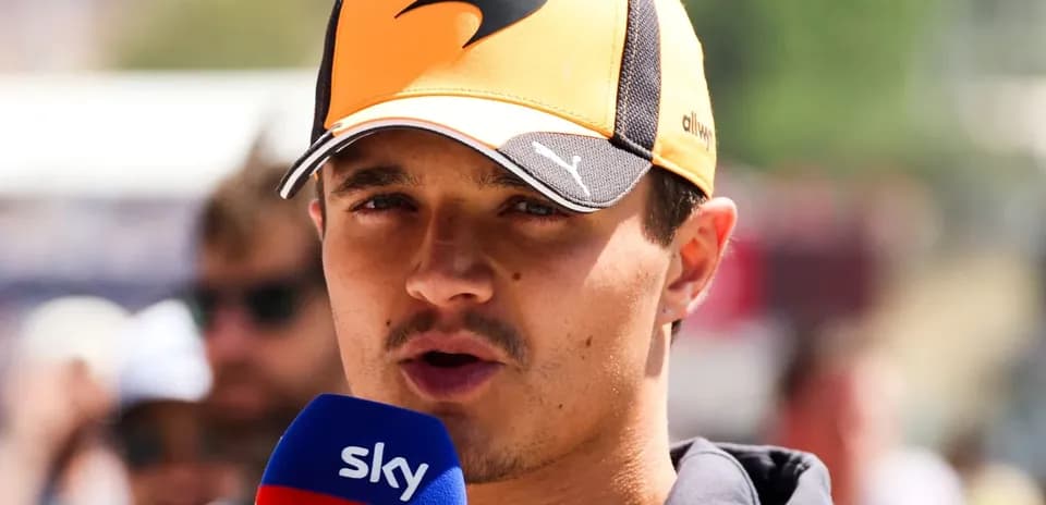 Driver speaking into microphone during event interview