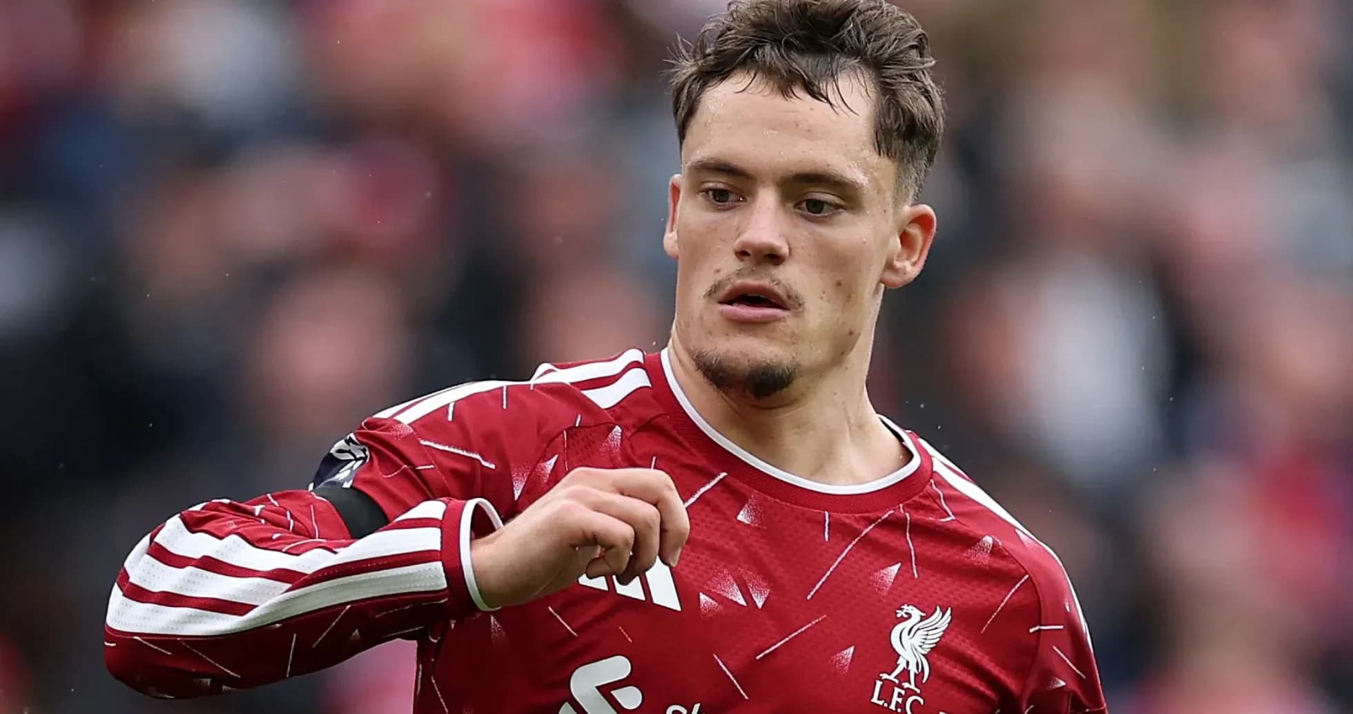 Player wearing Liverpool kit during match action