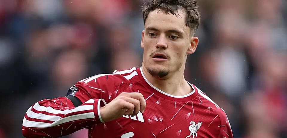 Player wearing Liverpool kit during match action