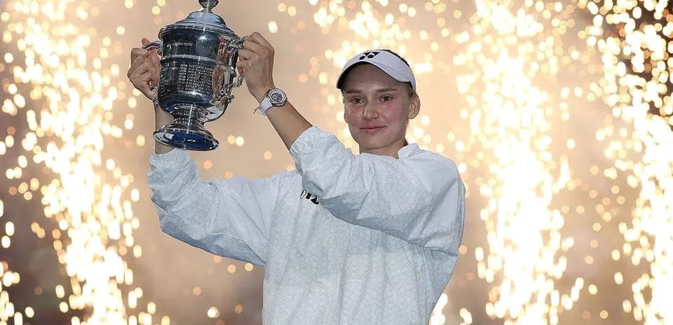 Player celebrating with trophy amid fireworks