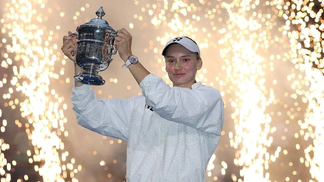 Player celebrating with trophy amid fireworks