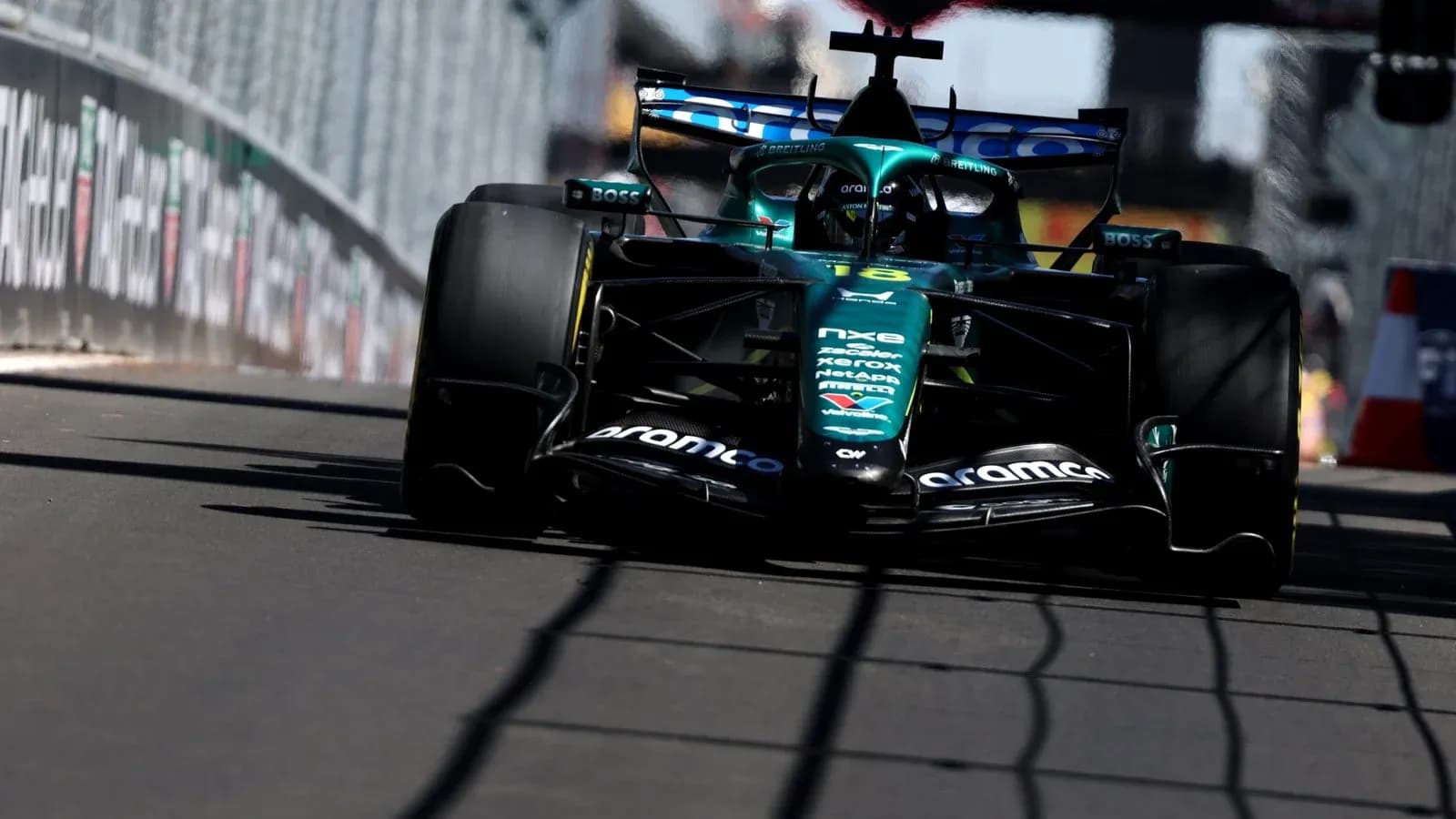 Formula 1 car racing on street circuit track
