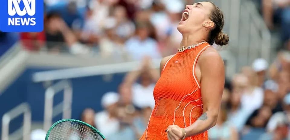 Tennis player celebrating with raised fist on court