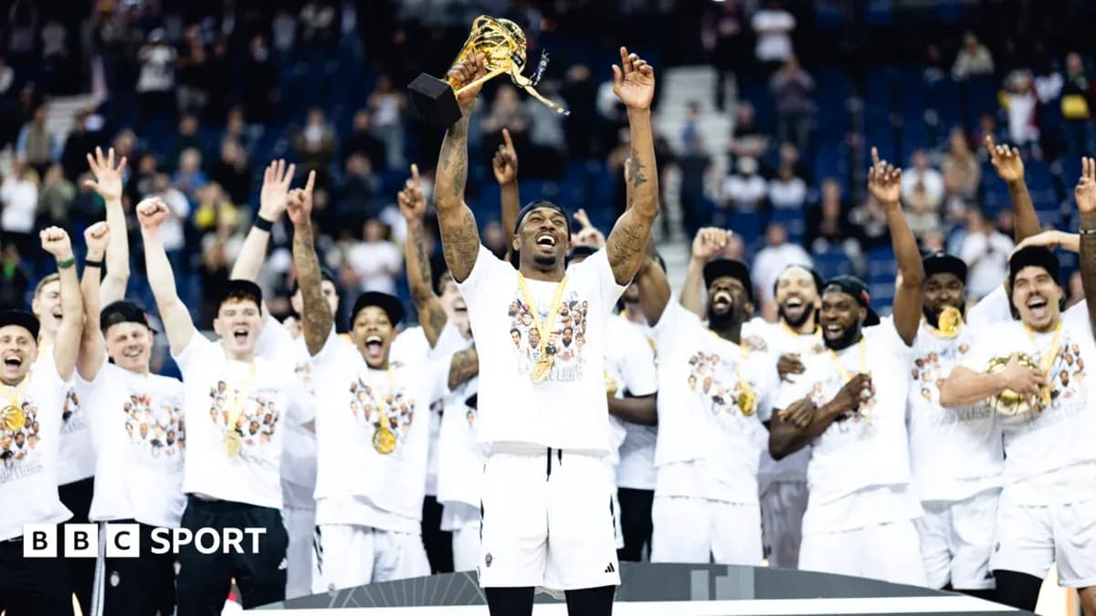 Team celebrating with trophy after championship victory