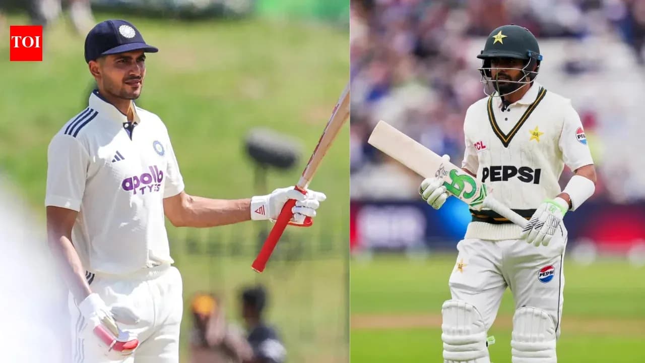 Two cricketers holding bats on the field
