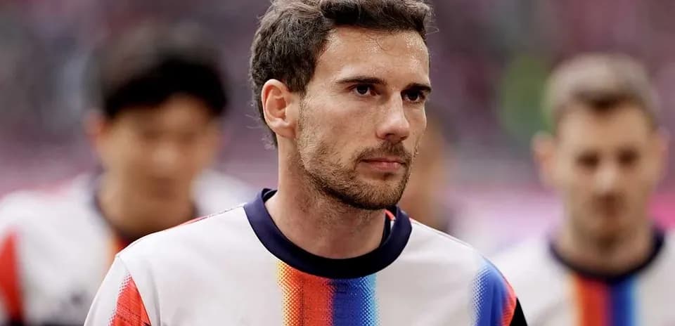 Player walking onto the pitch before the match