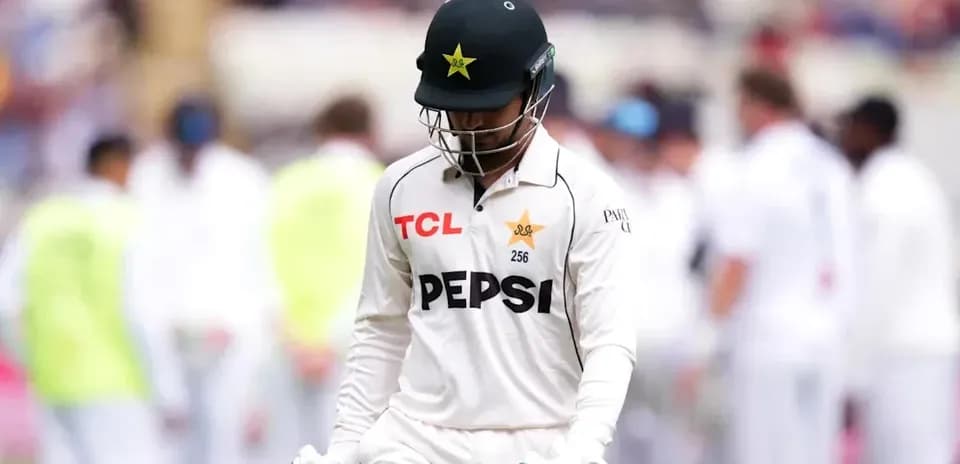 Cricketer walking off the field after dismissal