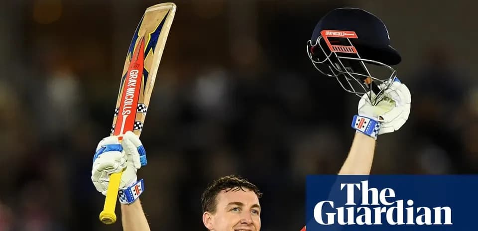 Cricketer celebrating with bat and helmet raised