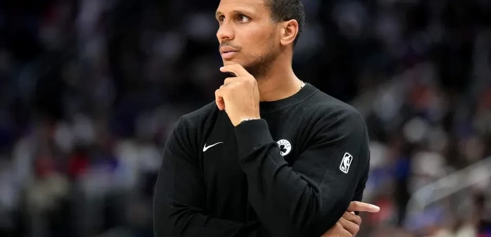 Coach observing game from the sideline