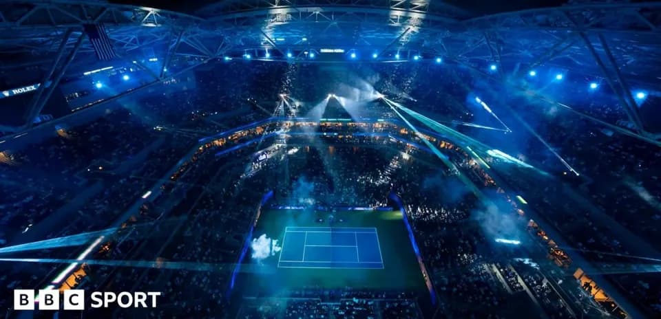 Aerial view of illuminated tennis stadium at night